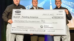 Tom Ondo (left), vice president &amp; general manager, Americas Truck/Trailer/Rail, and Jon Shaw (right), director, Global Communications &amp; Sustainability, Carrier Transicold &amp; Refrigeration Systems, present a $150,000 check to Bill Thomas, chief supply chain officer, Feeding America, for the donation and installation of transport refrigeration units to seven Feeding America member food banks across the U.S.