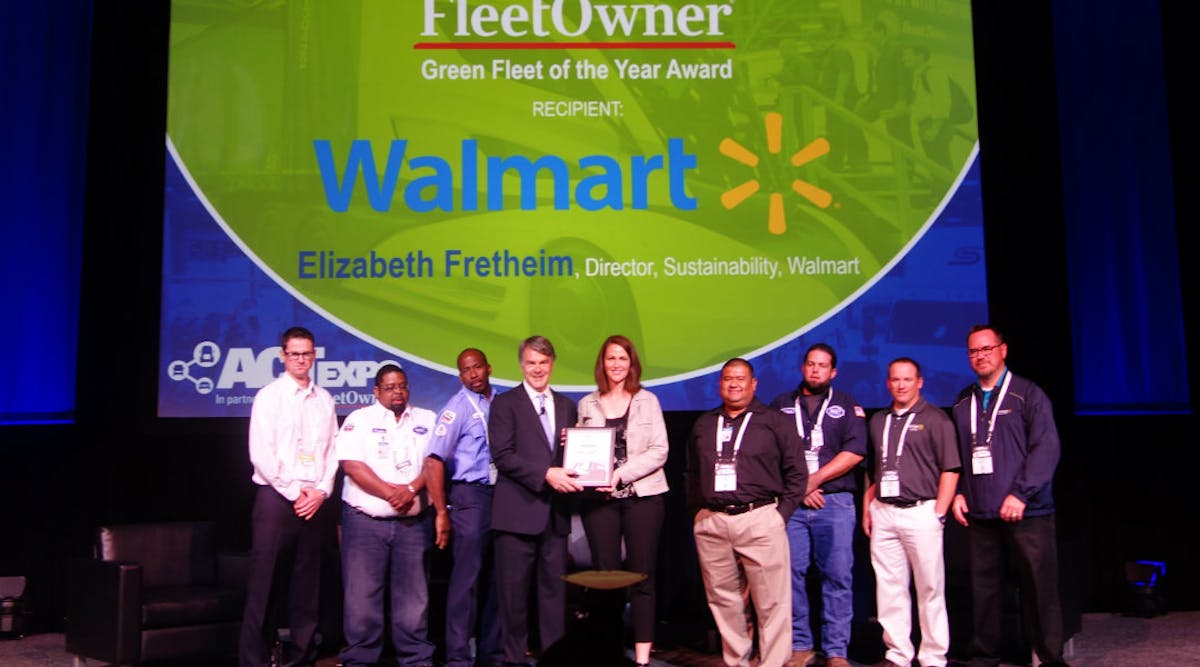 Elizabeth Fretheim (center) and Walmart associates receive the 2017 Fleet Owner Green Fleet of the Year from editor emeritus Jim Mele at ACT Expo in Long Beach, CA.