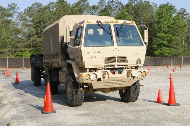 A soldier in the US Army navigates through a set of cones during a truck rodeo in April Photo Sgt Kyle FischUS Army