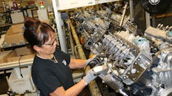 A lawsuit alleges that GM pickup trucks with Duramax diesel engines (shown above in production) include three devices that are rigged to allow more pollution on the road than during treadmill tests in the Environmental Protection Agency laboratory.