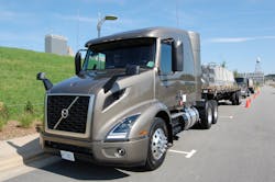 A pair of new Volvo VNR 640 models configured with midroof sleepers being readied for test drives with flatbed trailers loaded with concrete blocks Photo Sean KilcarrFleet Owner A pair of new Volvo VNR 640 models configured with midroof sleepers being readied for test drives with flatbed trailers loaded with concrete blocks Photo Sean KilcarrFleet Owner