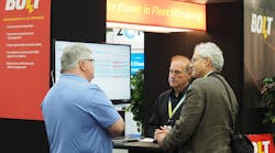 BOLT CTO Jerry Robertson (center) demos the company&apos;s voice-activated interface app for the BOLT fleet management system, or FMS, at the National Private Truck Council&apos;s (NPTC) Annual Conference in Cincinnati.
