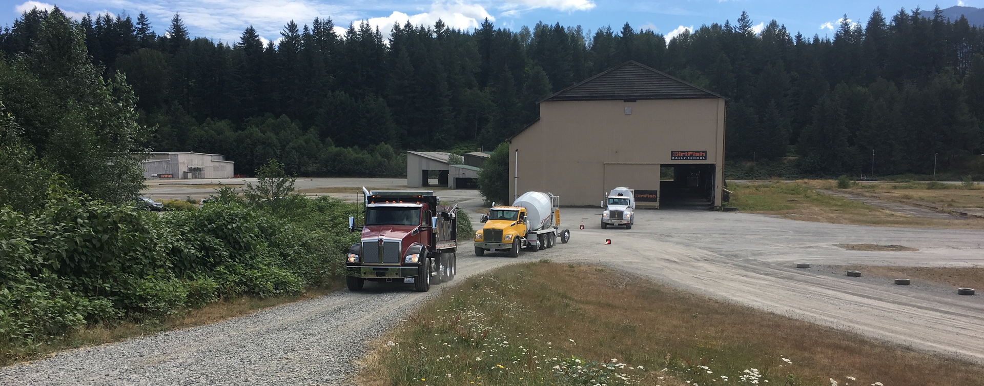 Several of Kenworth39s vocational models head out for test drives on July 21 at DirtFish Rally School in Snoqualmie WA Photo Neil AbtFleet Owner