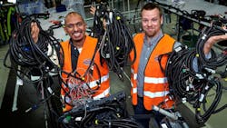 Volvo Truck employees holding cables Volvo Truck employees holding cables