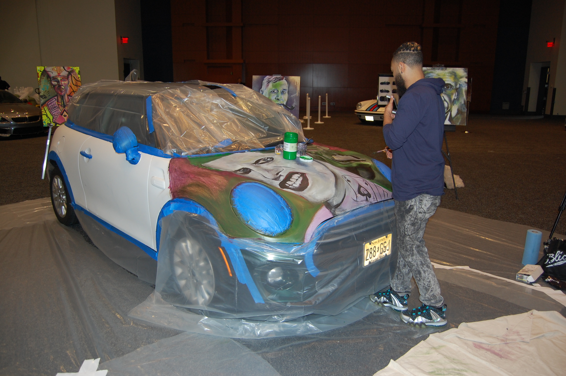 Jamaal Lamaaj painting a car Photo by Sean Kilcarr for Fleet Owner