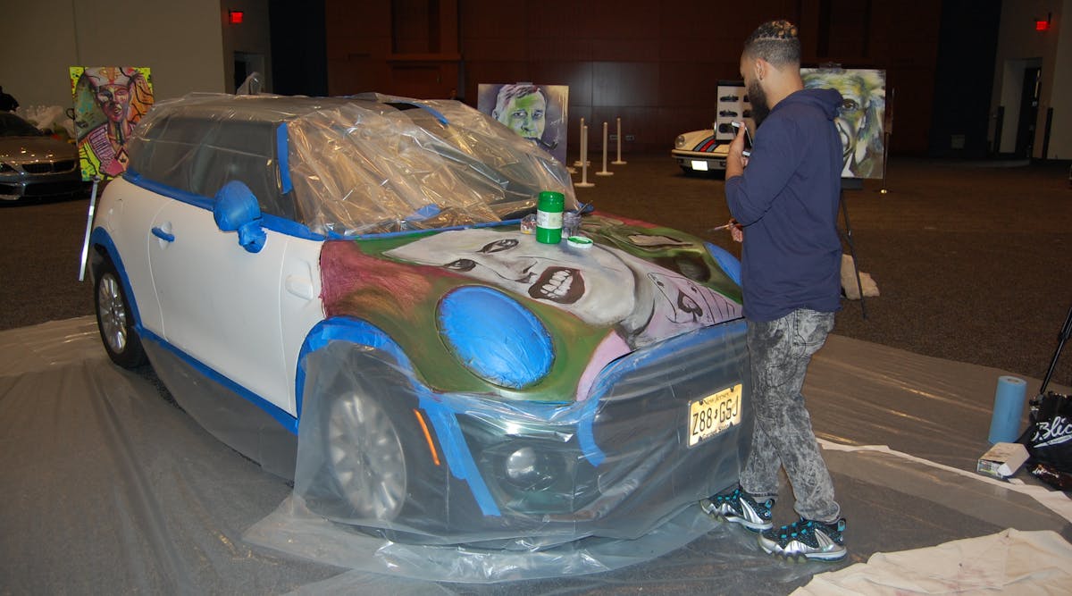 Jamaal Lamaaj, painting a car. Photo by Sean Kilcarr for Fleet Owner.