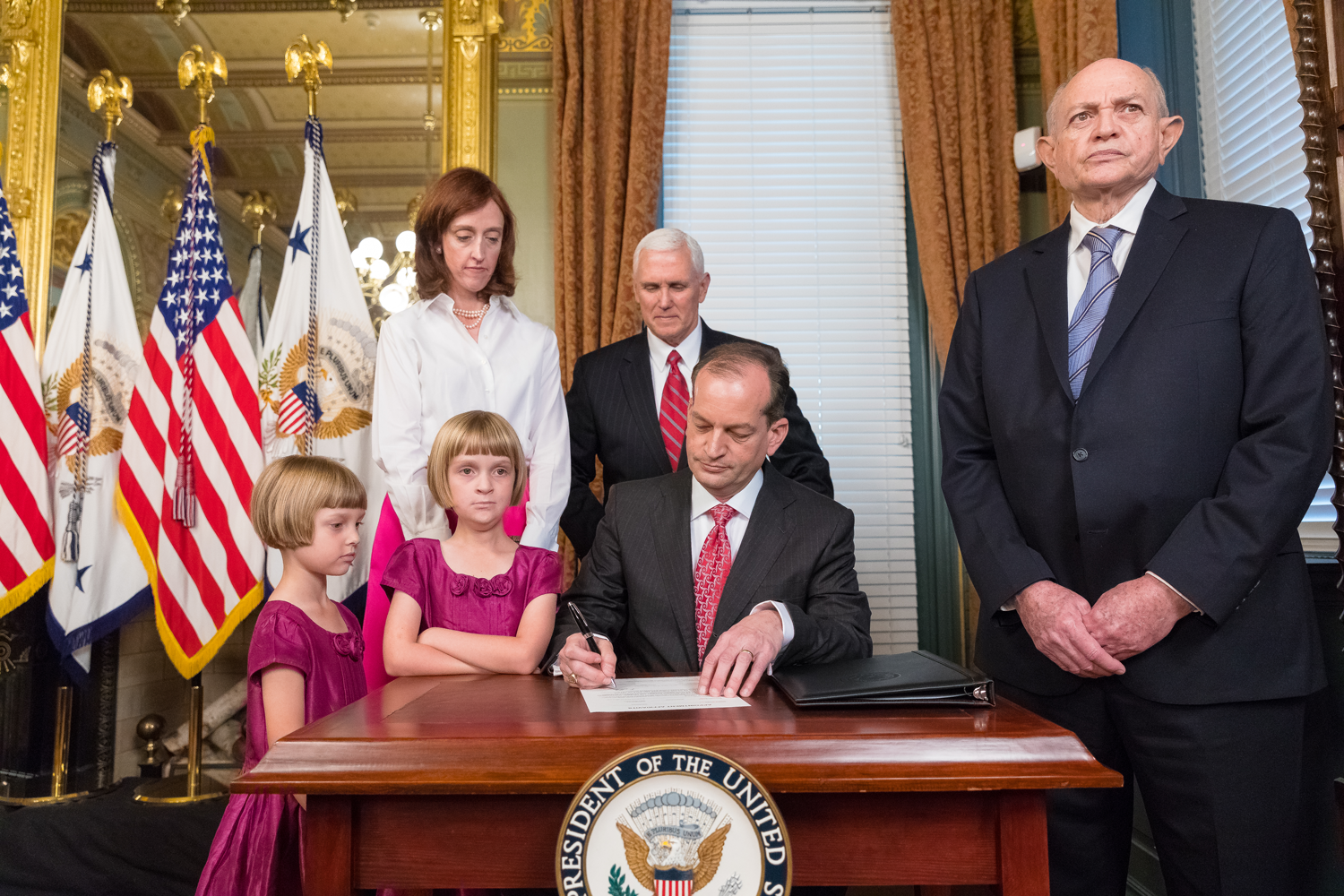 Alexander Acosta signs paperwork after being sworn in as secretary of the Department of Labor in April Photo The White House