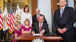 Alexander Acosta signs paperwork after being sworn in as secretary of the Department of Labor in April Photo The White House