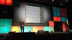 David Wangler (left) and Brian McLaughlin speak in front of a slide displaying just a few of the 22 algorithms needed for solving the Rubik&apos;s Cube puzzle. &apos;But there are no similar algorithms for solving the ever-changing puzzle that is the supply chain,&apos; McLaughlin noted. (Photo: Sean Kilcarr/Fleet Owner)