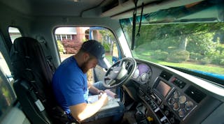 Shawn Carlton, owner of McNel Septic Services in Ravensdale, WA, filling out paperwork in his &ldquo;mobile office.&rdquo; Could a truck do this by itself? (Photo: Kenworth)