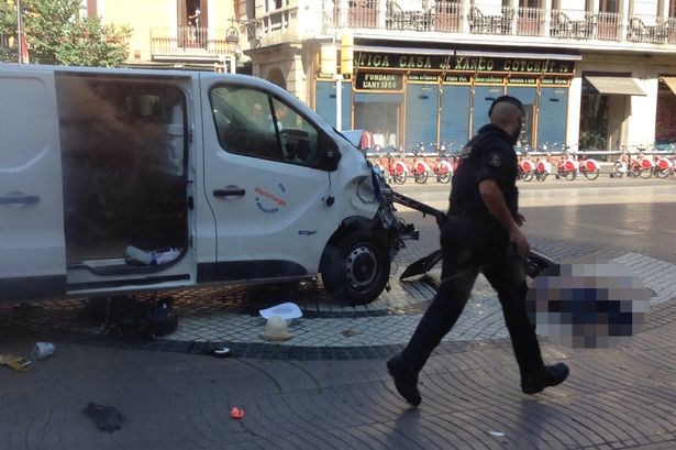 The white van seen here reportedly mowed down pedestrians in central Barcelona killing 14 people Photo via Twitter