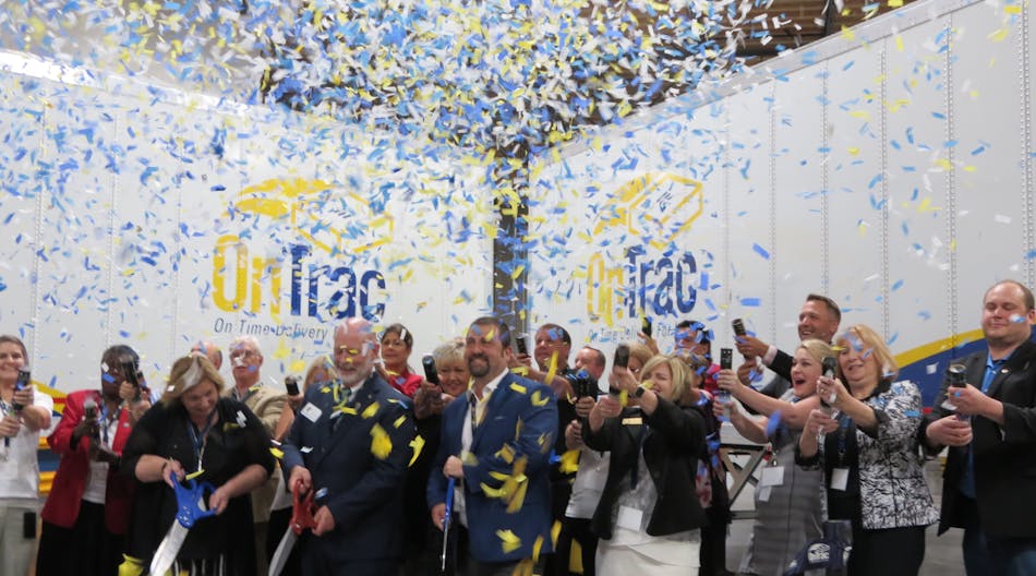 OnTrac employees and officials with the city of Vancouver, WA, cut the ribbon to celebrate the new 65,000-square-foot facility, almost three times larger than the building it replaces. (Photo: Neil Abt)