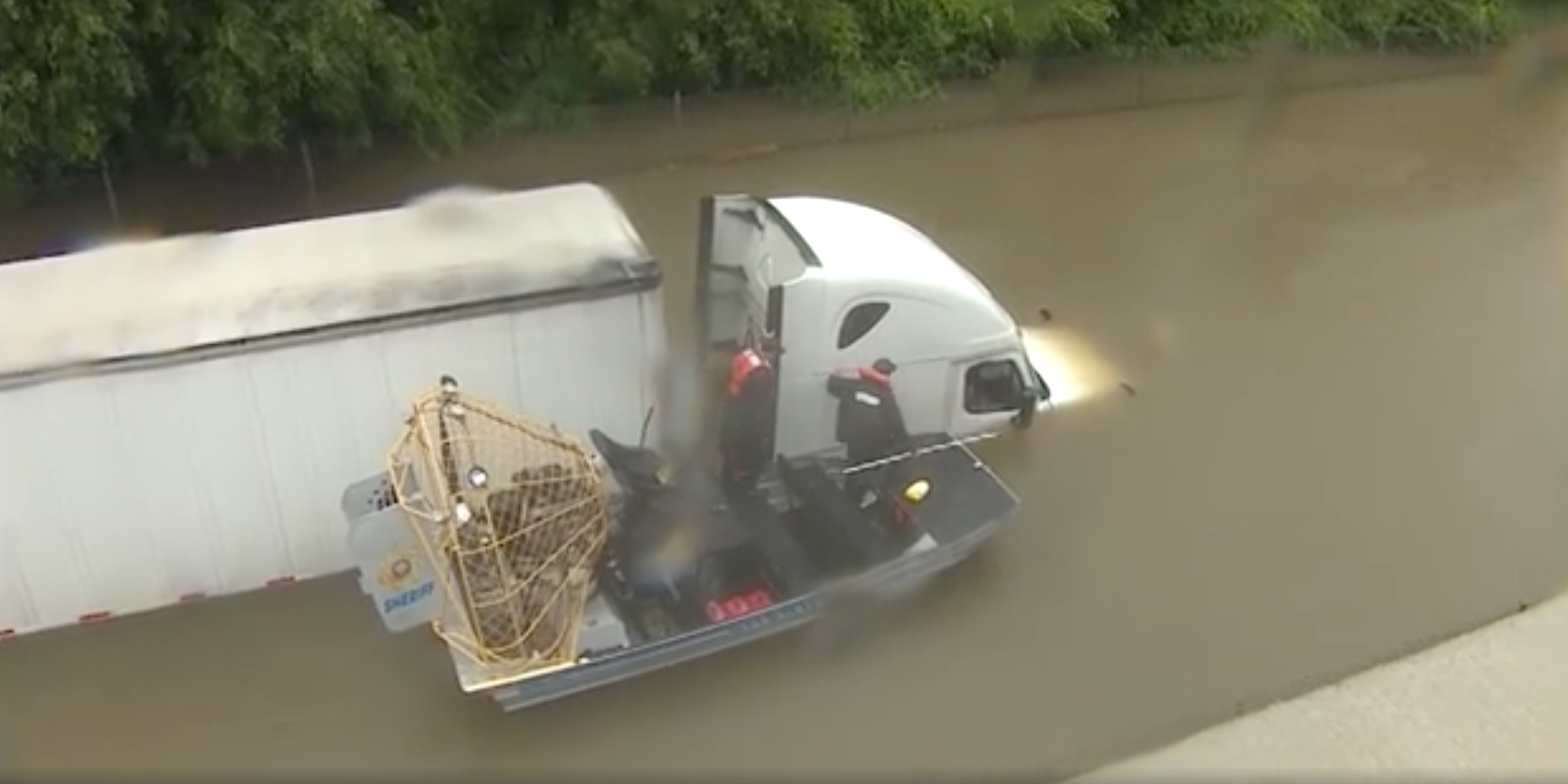 A truck driver is rescued after being stranded on a flooded road in Houston from Hurricane Harvey Photo Brandi Smith