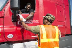 Shannon Woodyard at right with the Defense Logistics Agency speaks to a US Xpress Enterprises truck driver preparing to pick up a load of humanitarian supplies at the San AntonioSequin Auxiliary Air Field in Texas in support of Hurricane Harvey disaster relief efforts US Air Force photo by Sean M Worrell Shannon Woodyard at right with the Defense Logistics Agency speaks to a US Xpress Enterprises truck driver preparing to pick up a load of humanitarian supplies at the San AntonioSequin Auxiliary Air Field in Texas in support of Hurricane Harvey disaster relief efforts US Air Force photo by Sean M Worrell