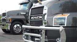 Mack showed off updates to its Granite and Pinnacle axle-forward models (Pinnacle shown in background) including redesigned interiors and a new grille for the Pinnacle with bold &apos;Mack&apos; moniker similar to that of the company&apos;s new Anthem highway truck, shown in foreground. (Photo: Aaron Marsh/ Fleet Owner)