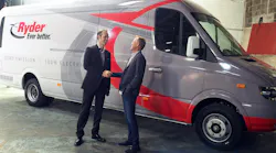 Chanje CEO Bryan Hansel, right, hands over the keys to one of Ryder's first 125 Chanje V8070 panel vans to Ryder's Chris Nordh.