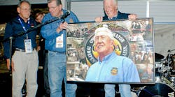 Johnston (holding picture) served as OOIDA&apos;s president and CEO for over 43 years.