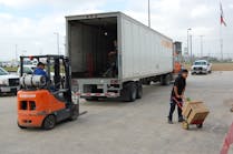 Workers loading freight