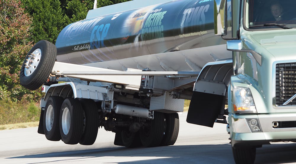 A truck equipped with Bendix&apos;s electronic stability control technology and outriggers demonstrates rollover accidents that this advanced safety system can guard against.