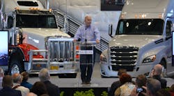 DTNA president and CEO Roger Nielsen speaks at the opening of the company&apos;s test track in Madras OR.