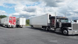 Semi-trucks and trailers at truck stop Semi-trucks and trailers at truck stop