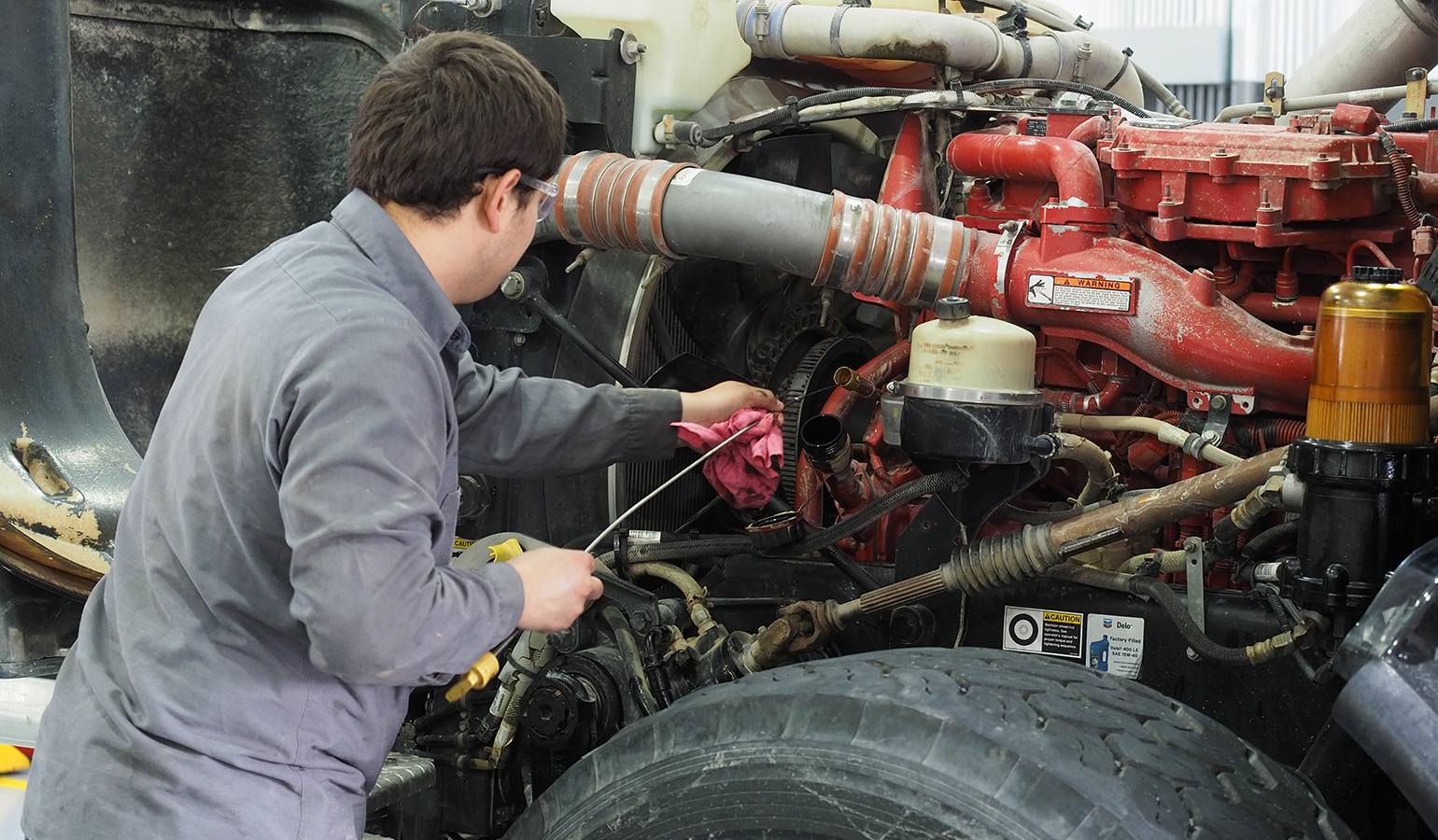 Technician changing oil
