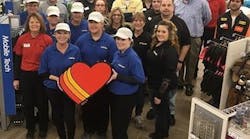 The Love&apos;s Travel Stops staff celebrates the opening of its newest store in Capac, MI, on March 22, 2018.