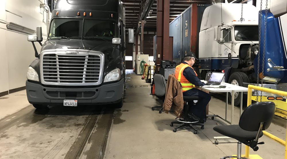 Oregon DOT&apos;s Abe Dunivin uses his laptop to check hours-of-service data during random inspections on Interstate 5.