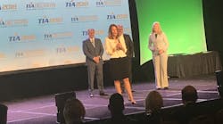Renee Krug accepts the award on April 10 at the TIA annual conference.