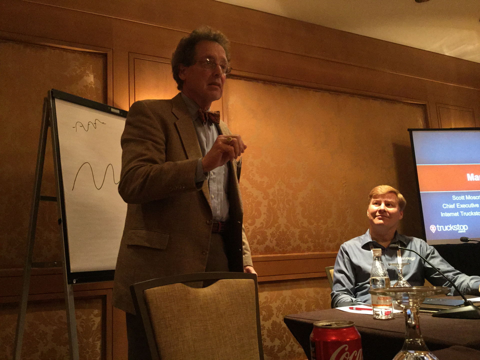 Transportation economist Noeumll Perry briefs supply chain executives as Internet Truckstop Group founder and CEO Scott Moscrip looks on