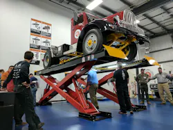 A 1946 Brockway 260XW heavyduty truck is up on a lift that is being inspected by men during an inspector certification class at the new Automotive Lift Institute39s LiftLab in Cortland NY Photo Josh FisherFleet Owner