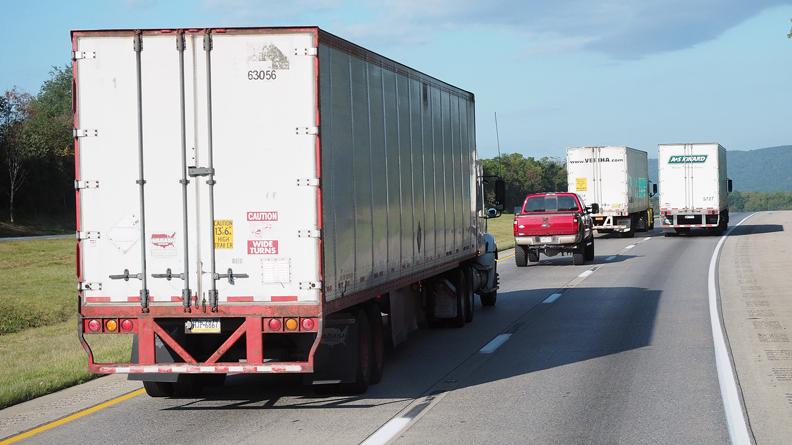 Trucks mixing with passenger cars on highway