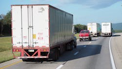 Trucks mixing with passenger cars on highway Trucks mixing with passenger cars on highway