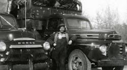 Big Freight Systems founder Seaton &ldquo;Red&apos; Coleman stands next to a 1948 Dodge and a 1949 Mercury operated by South East Transfer, the company he and his father bought in 1948. South East Transfer adopted its new name, Big Freight Systems, in 1996.