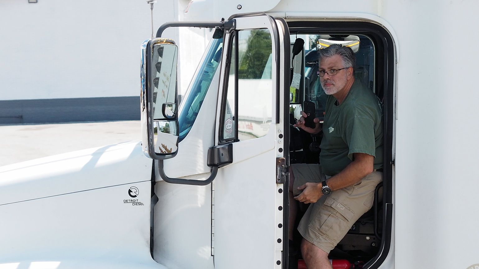 Truck driver entering heavy truck