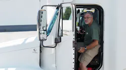 Truck driver entering heavy truck