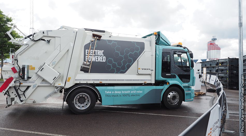 The Volvo FL Electric refuse truck tops up its charge.