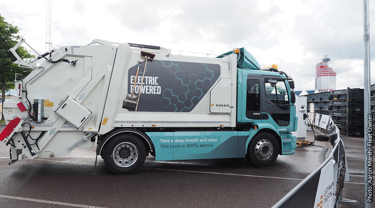 The Volvo FL Electric refuse truck tops up its charge.