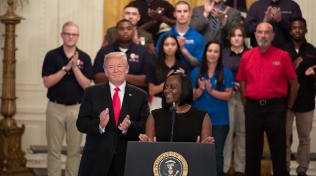 President Trump applauds during a White House event celebrating the president&apos;s Pledge to America&rsquo;s Workers executive order.