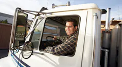 Truck driver beyond the wheel in day cab