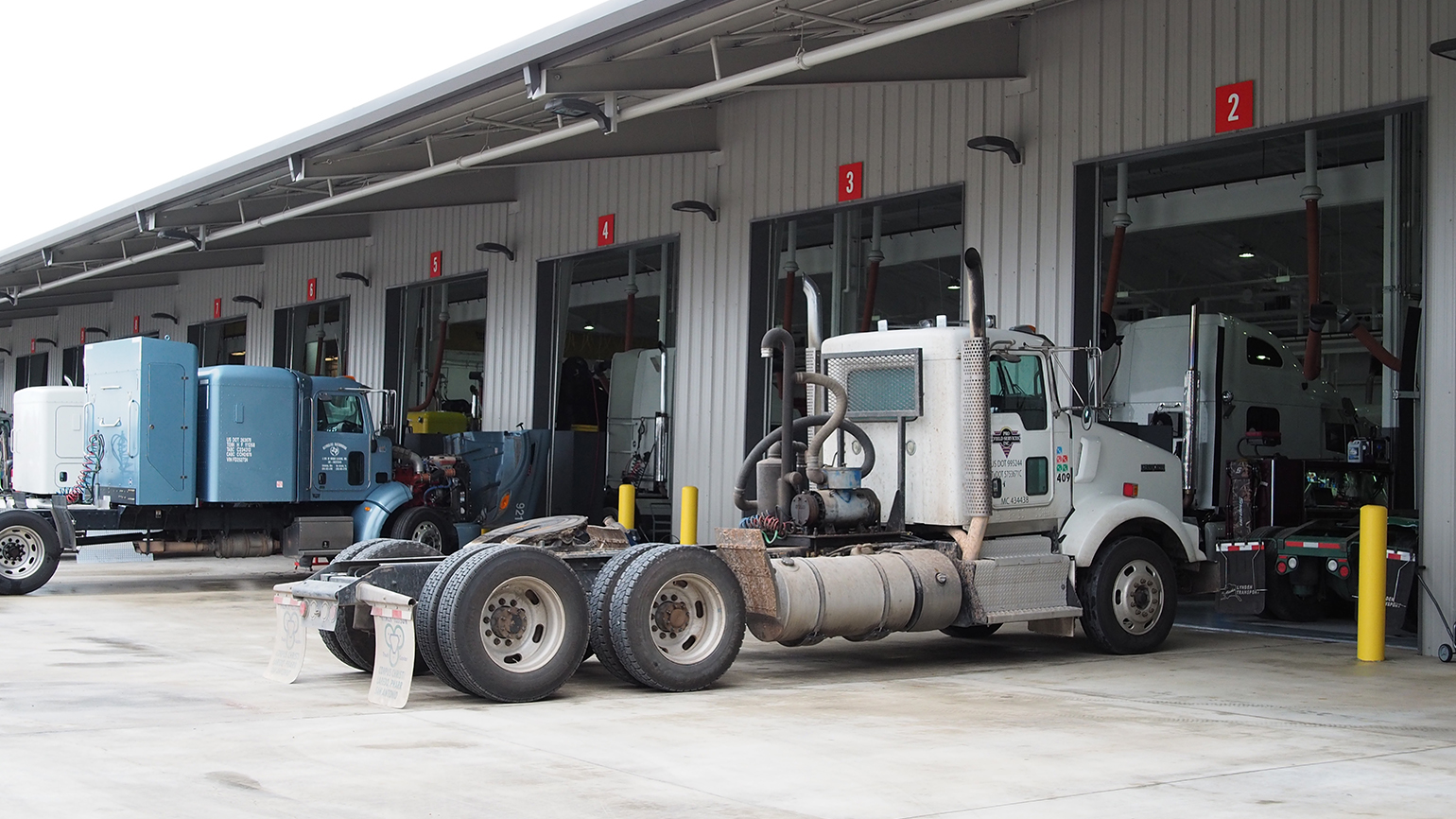 trucks at maintenance bay