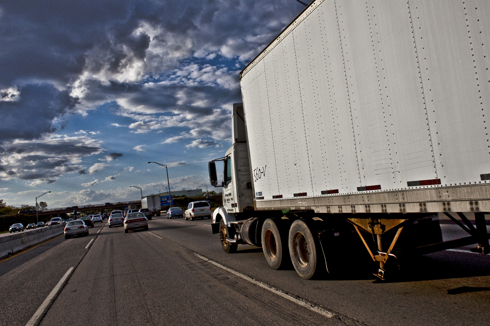 truck storm clouds highway