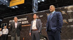 Spartan&rsquo;s Daryl Adams, president and CEO, left; Chad Heminover, president of Utilimaster; and Eric Fisher, director of engineering, talk about three new Utilimaster delivery vehicles at he 2019 Work Truck Show.