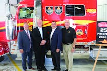 Peterbilt and Decker officials pose with the special Model 389.