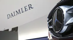 The Daimler and Mercedes logos