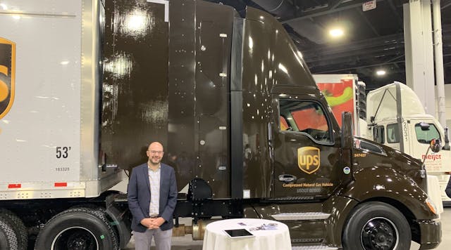 Daniel Burrows, XStream&apos;s founder and CEO, poses with the UPS tractor-trailer that participated in &apos;Run on Less.&apos; The vehicle includes the TruckWings aerodynamic device.