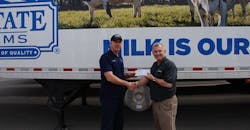 Larry Gardner, at left, receives a Fuel Champ Award from Ed McCarthy, vice president of operations and customer success at Vnomics. Larry Gardner, at left, receives a Fuel Champ Award from Ed McCarthy, vice president of operations and customer success at Vnomics.