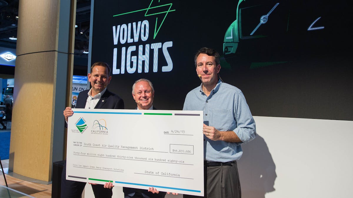 VTNA President Peter Voorhoeve (left) poses with a funding check for Volvo LIGHTS at ACT Expo in May 2019.