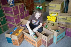 Carlisle Girl Scout Abby Hugen, 8, packs cases of cookies to donate and distribute. Carlisle Girl Scouts is holding a donation drive to give cookies to essential workers. Carlisle Girl Scout Abby Hugen, 8, packs cases of cookies to donate and distribute. Carlisle Girl Scouts is holding a donation drive to give cookies to essential workers.