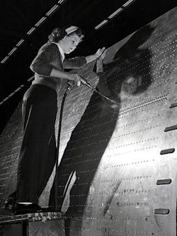 A riveter works on a B-24 bomber at Ford&apos;s Willow Run plant during World War II.